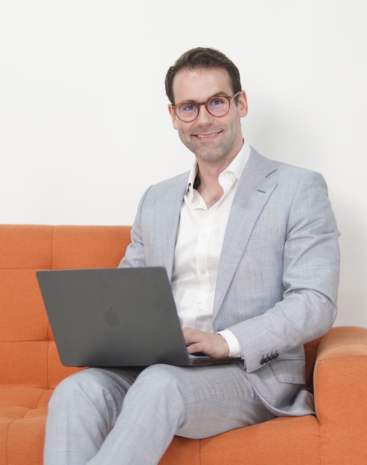 Thibault Genon-Catalot, founder of NextChannel Studio, working on a laptop